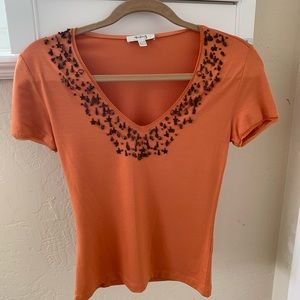 Orange top with short sleeves